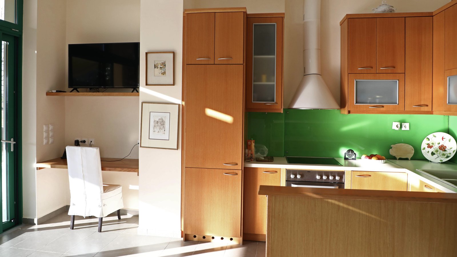 A great view of the kitchen area and office space in Eucalyptus Villa Aegina, Greece.